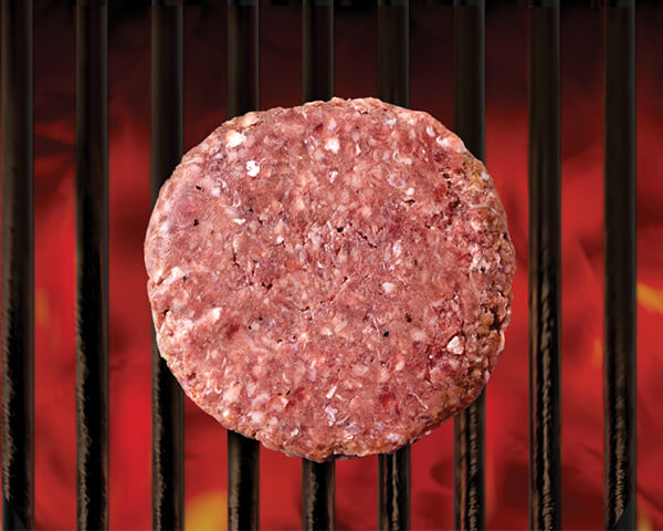 Raw Black River burger on grill