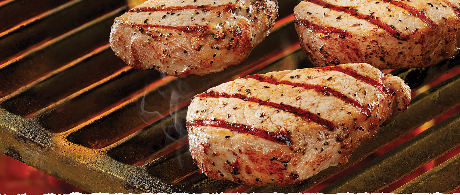 Black River pork loin chops on grill